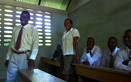 The school director Jacob (left) and the teachers meet with the mission team in one of the classrooms to discuss the school's status, their priorities and needs.